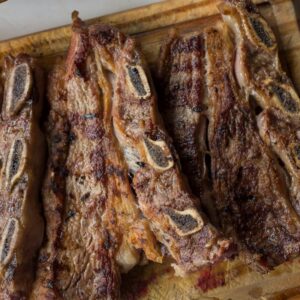 Delicious traditional Argentine asado, grilled steaks with bread, perfect for a classic meal.